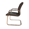 Designer armchair in plastic and fake leather