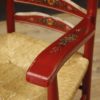 Dutch armchair in red painted wood with floral decorations