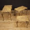 Triptych of Italian side tables in golden brass with marble top