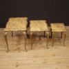 Triptych of Italian side tables in golden brass with marble top