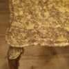 Triptych of Italian side tables in golden brass with marble top