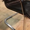 Designer armchair in plastic and fake leather