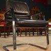 Designer armchair in plastic and fake leather