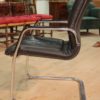 Designer armchair in plastic and fake leather