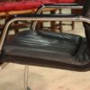 Designer armchair in plastic and fake leather