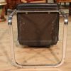 Designer armchair in plastic and fake leather