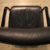 Designer armchair in plastic and fake leather