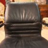 Designer armchair in plastic and fake leather