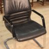 Designer armchair in plastic and fake leather