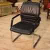 Designer armchair in plastic and fake leather