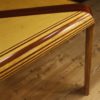 Italian design table in mahogany, maple and painted wood Italian design table in mahogany, maple and painted wood