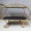 Brass and glass bar trolley, mid century serving trolley with black glass shelves