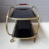 Brass and glass bar trolley, mid century serving trolley with black glass shelves