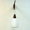 Wall lamp of teak and opaline glass Sweden 1950s