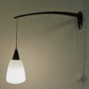 Wall lamp of teak and opaline glass Sweden 1950s