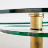 Roundish coffee table on brass legs