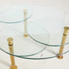Roundish coffee table on brass legs