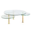 Roundish coffee table on brass legs