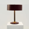 Burgundy table lamp in the manner of Jacques Adnet