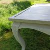 Table on bent legs in a rustic style. Table on bent legs in a rustic style.