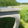 Table on bent legs in a rustic style. Table on bent legs in a rustic style.