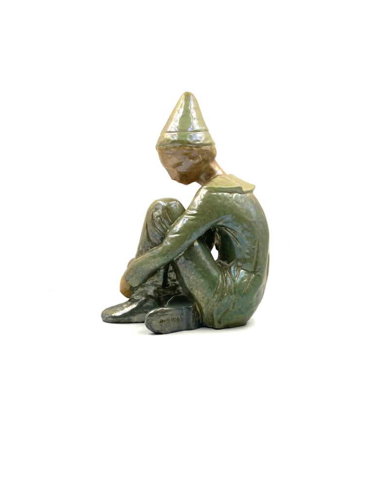 Ceramic green figure of Sitting boy, Giordano Tronconi, Faenza Italy, 1950s
