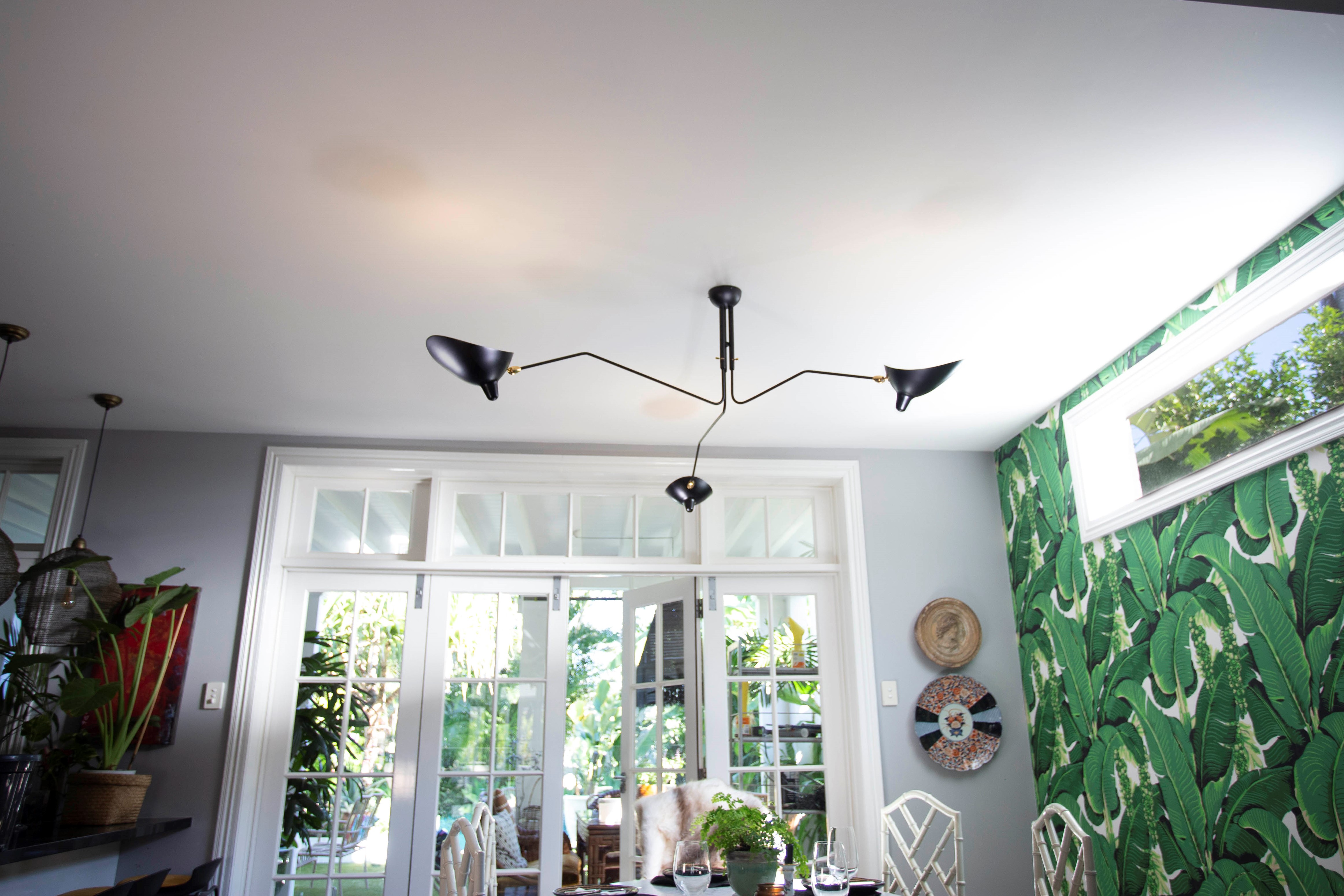 1592185980-Serge-Mouille-Three-Arm-Ceiling-Lamp-in-Situ.jpg